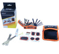Portable bicycle tire repair tool kit arranged on white