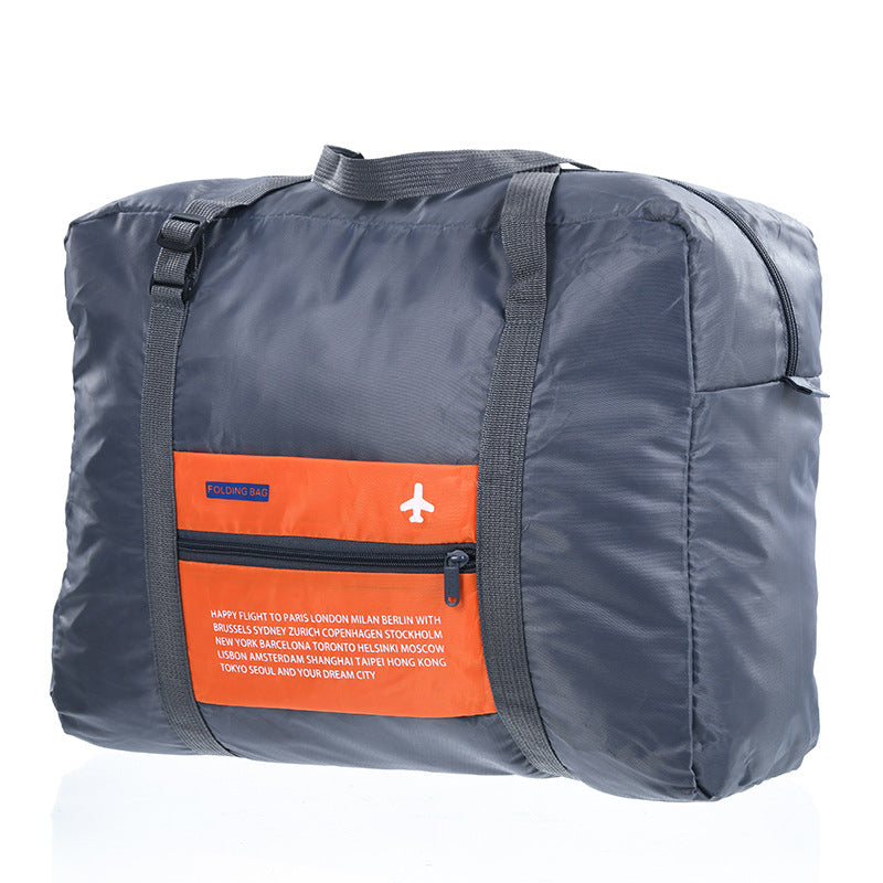 Orange foldable travel duffel bag on a white background
