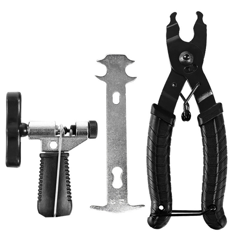 Bicycle chain repair kit with chain breaker, link pliers and gauge on white
