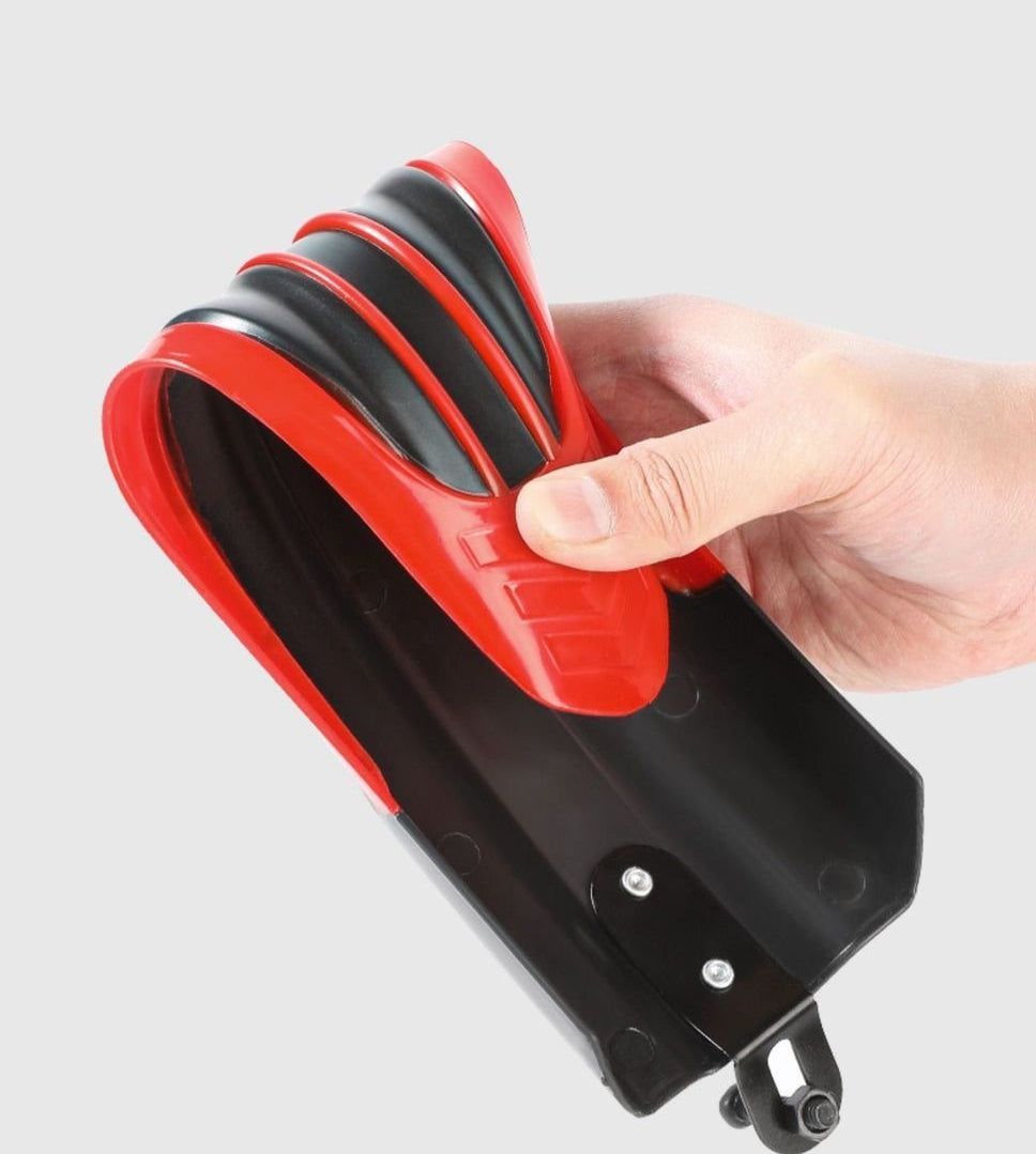 Hand flexing the red bicycle fender to show its bend