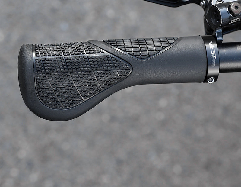Close view of the textured palm-support surface on an installed bicycle grip