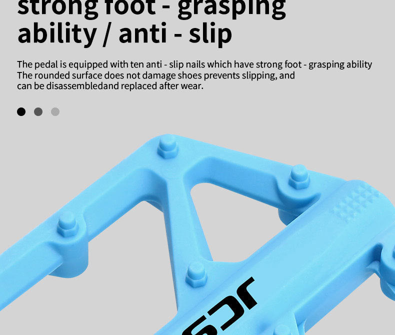 Close-up of the traction pins on a blue bicycle pedal