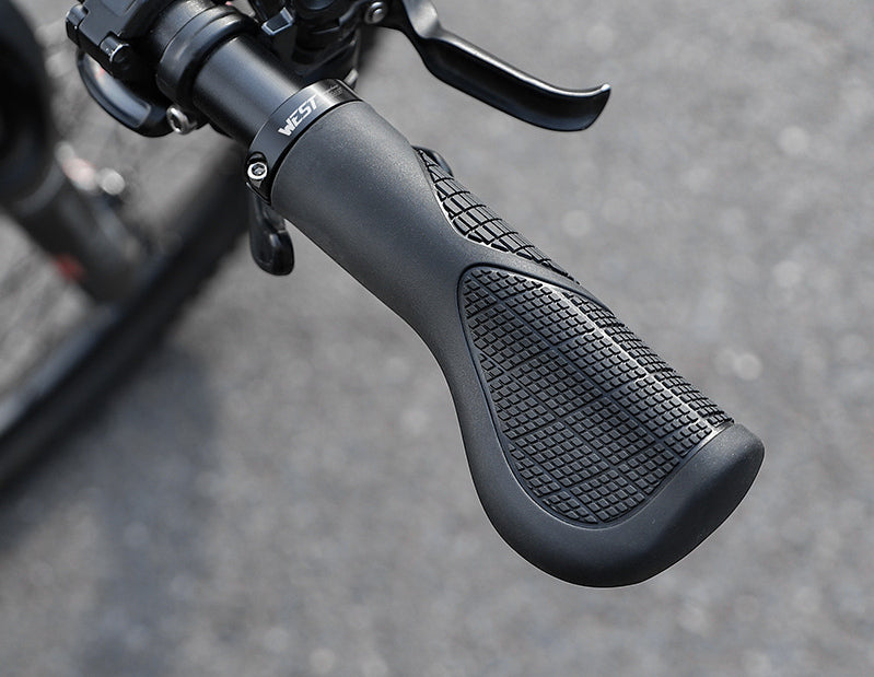 Black ergonomic bicycle grips installed on a handlebar