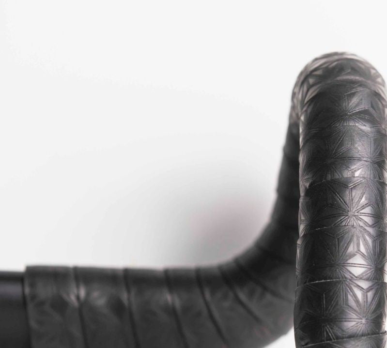 Black foam tape wrapped on a road bicycle handlebar