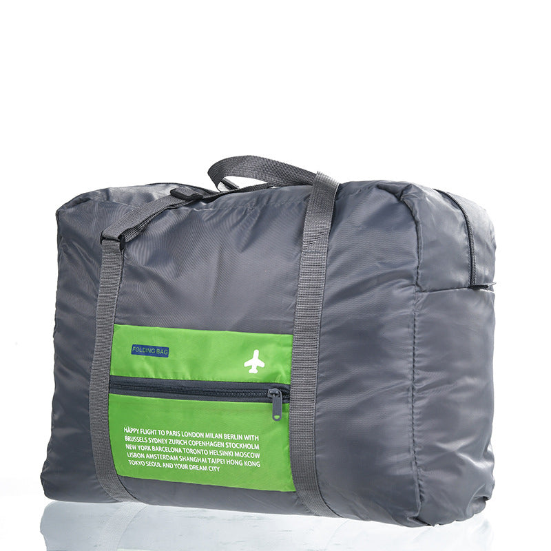 Green foldable travel duffel bag on white