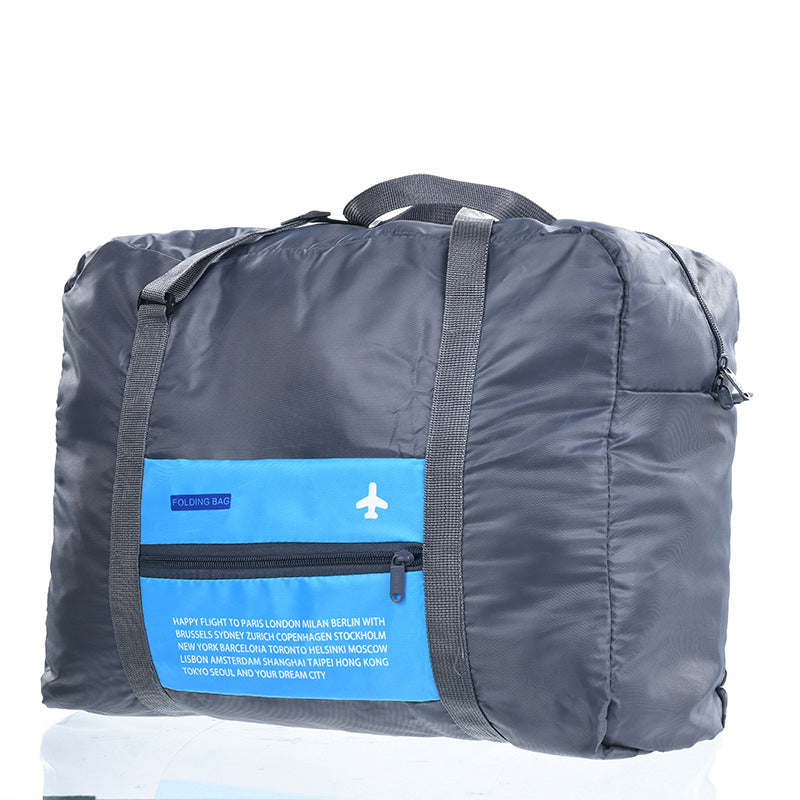 Blue foldable travel duffel bag on white