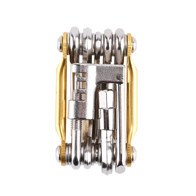 Gold compact bicycle multi-tool on white